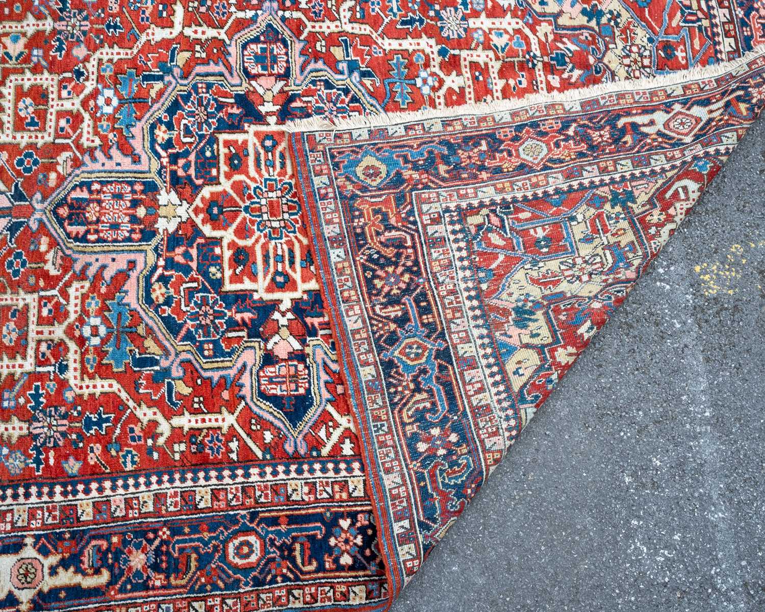 A red ground Heritz rug with geometric ornament to the central field and within a multiple banded - Image 2 of 2