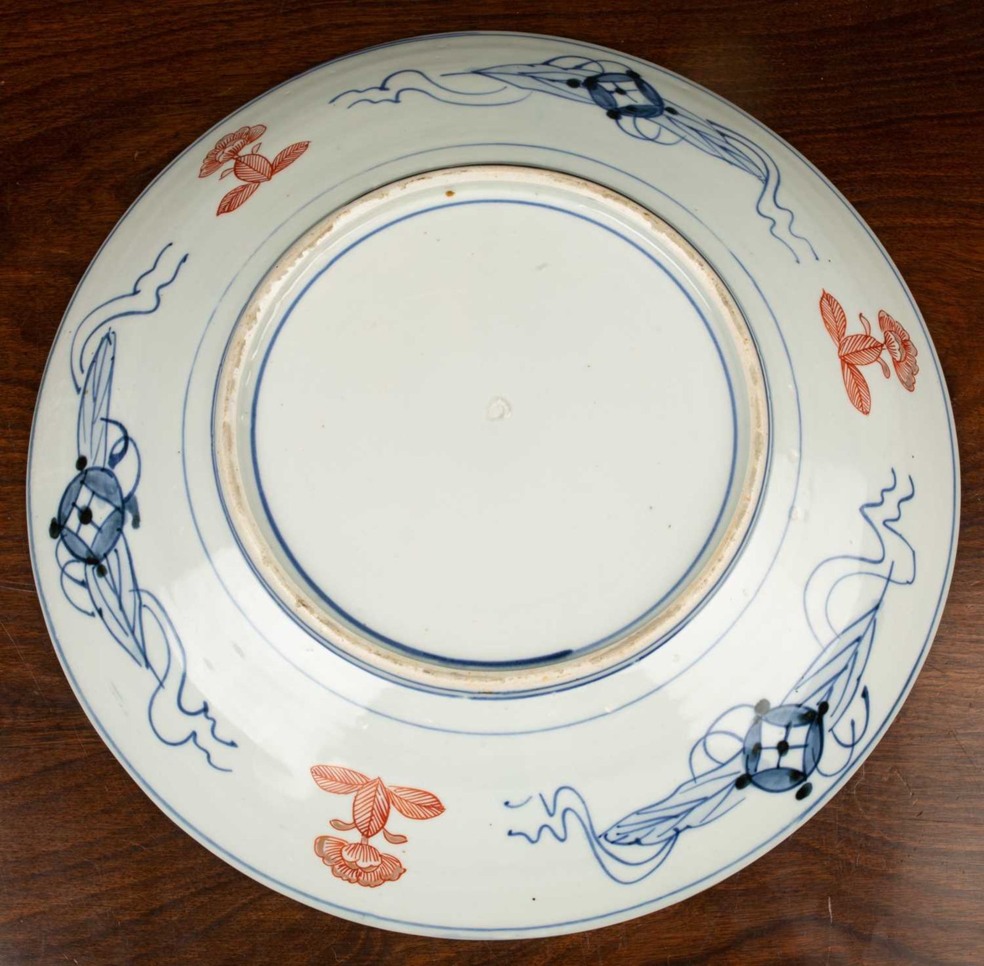 A 19th century Japanese charger, with central stylised flower medallion surrounded by panels of - Image 2 of 2