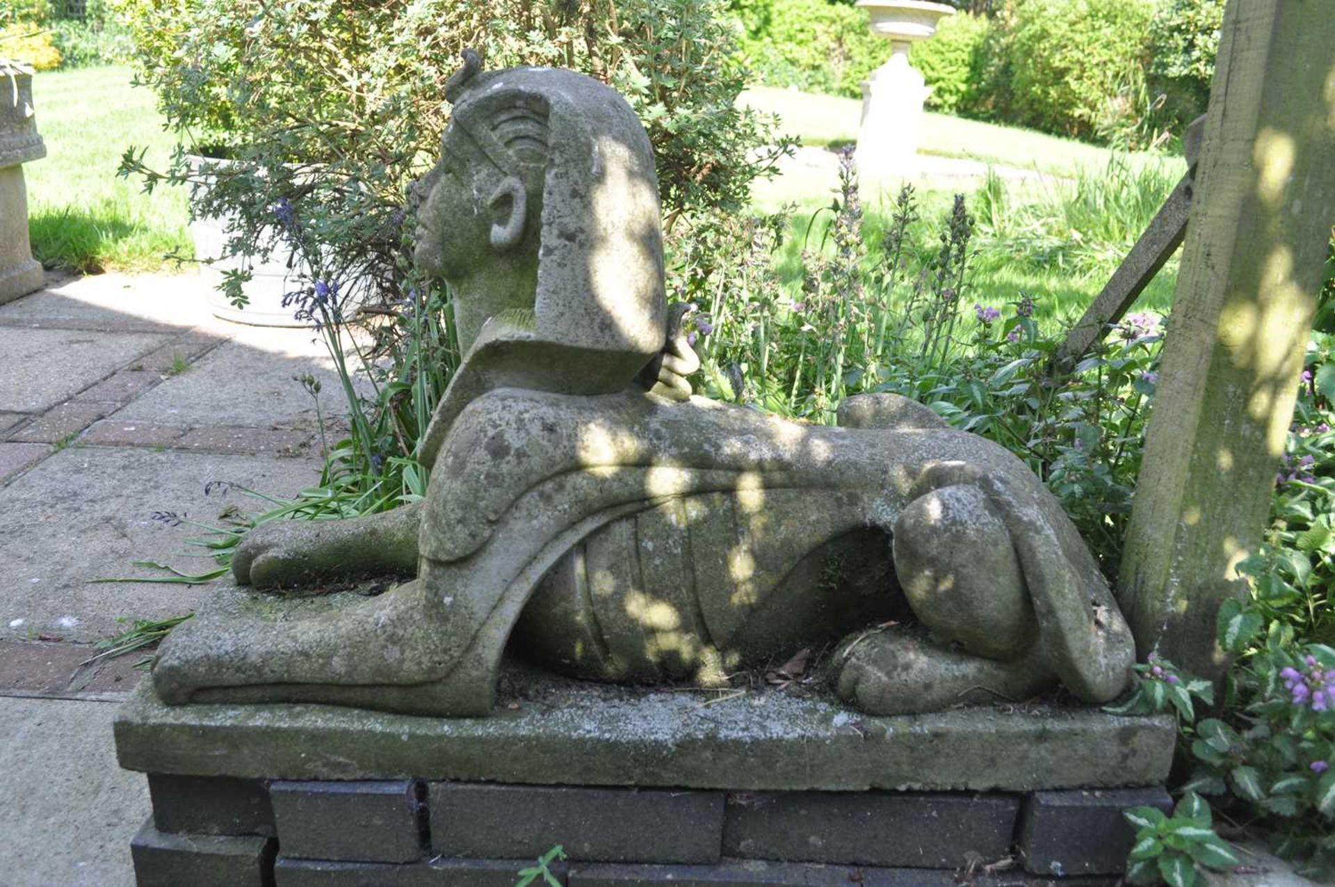 A garden sculpture in the form of a sphinx, 76.5cm long, 31cm wide, 49cm highWeathered overall. - Image 2 of 2