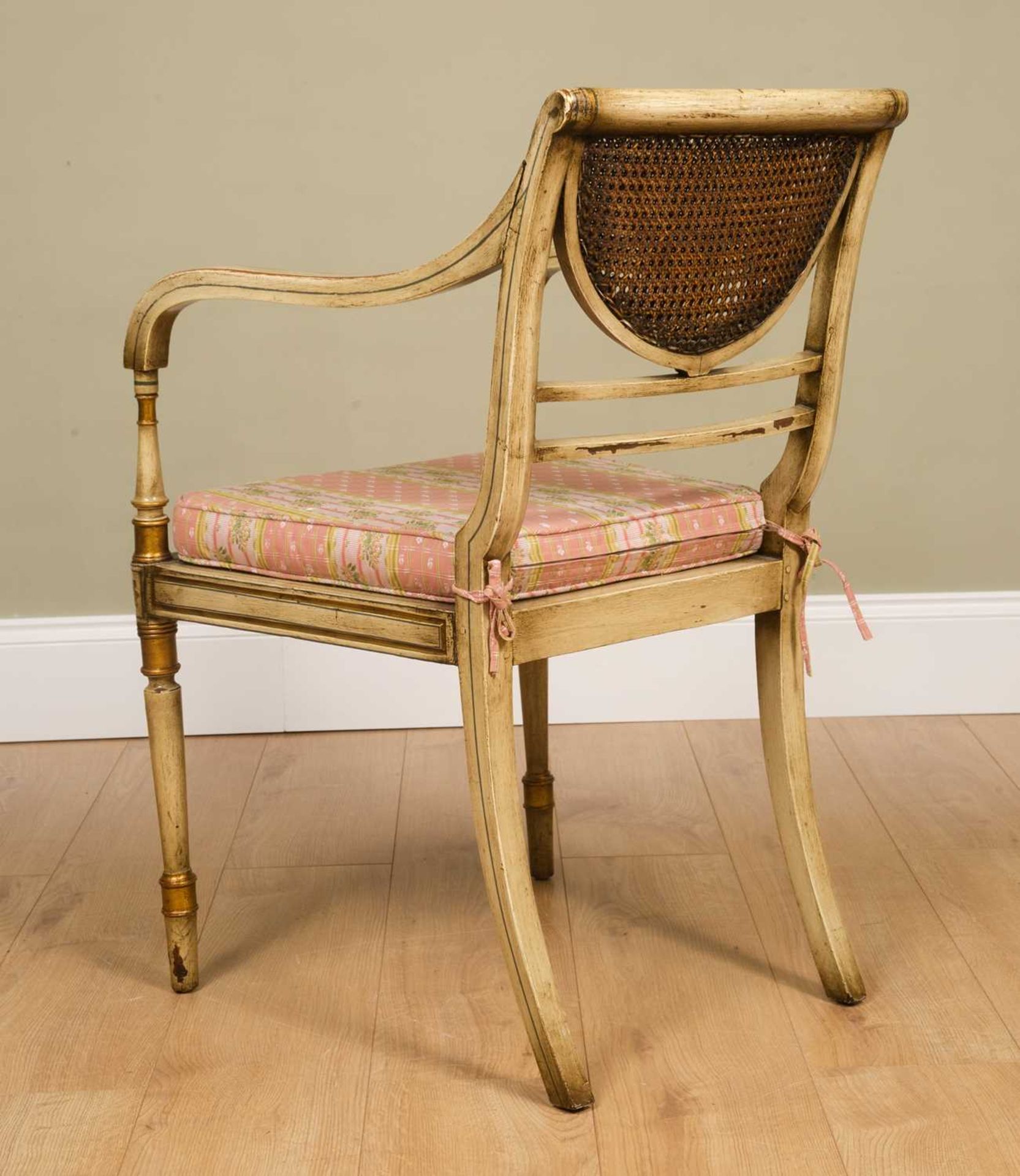 A Regency-style painted elbow chair, with caned back and seat, squab cushion, all standing on turned - Image 5 of 6