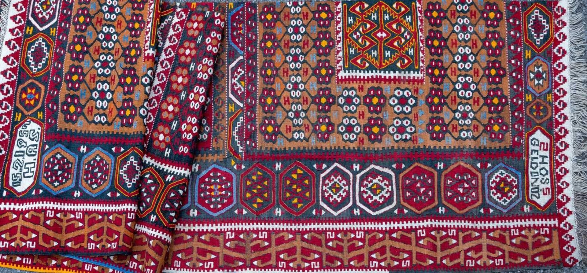 A Turkish flat weave carpet converted to a runner, with geometric decoration, 90cm x 404cmSection