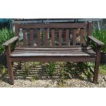 A teak garden bench with slatted back and seat, 122cm widthWeathered, structurally sound.