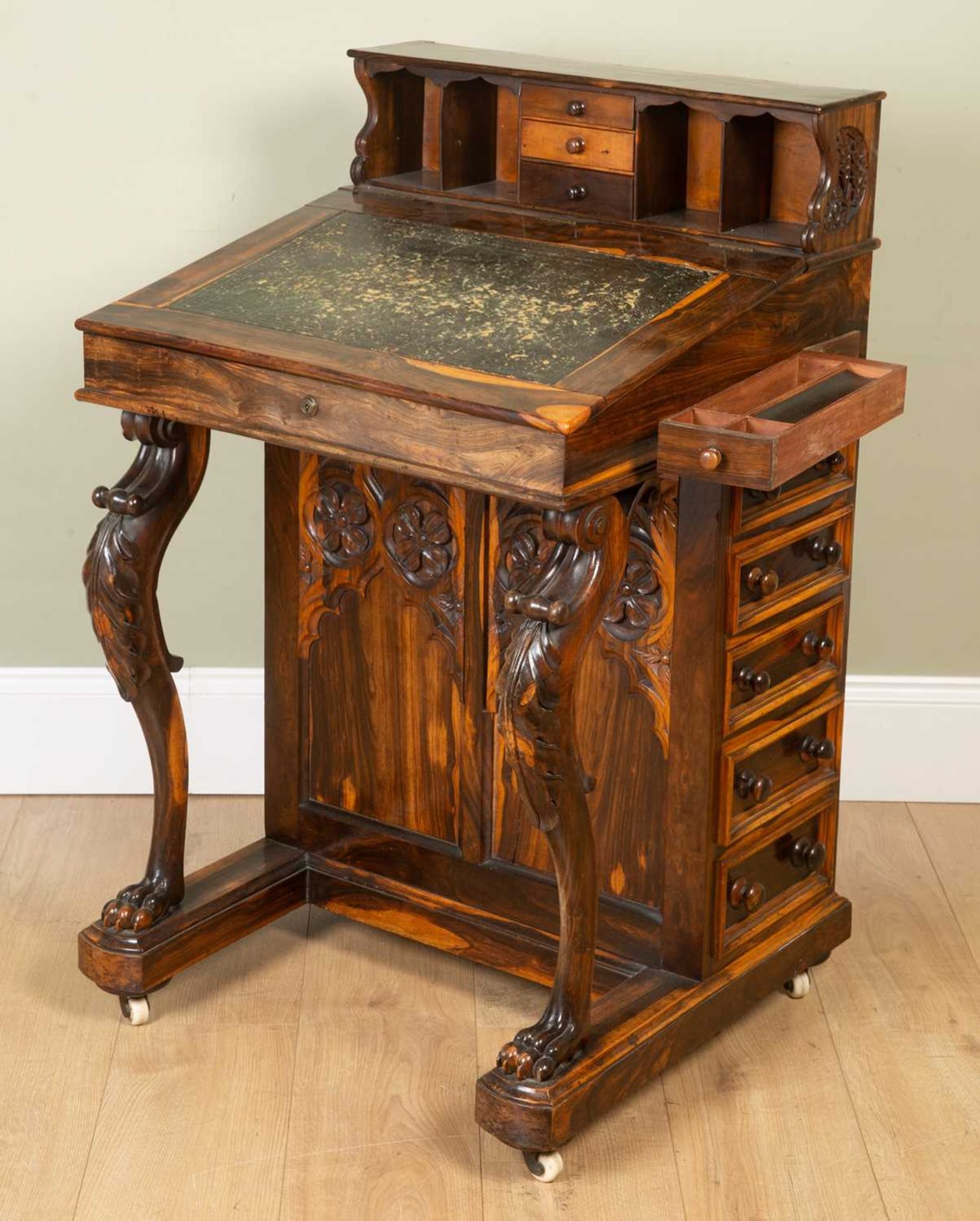 A William IV laburnum wood davenport desk, with Gothic blind tracery panels to the front and back,