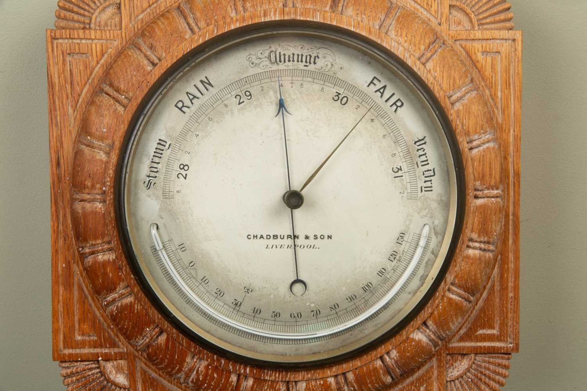 A Victorian aneroid barometer with Greek Revival limed oak case, around a silver dial with - Image 2 of 3