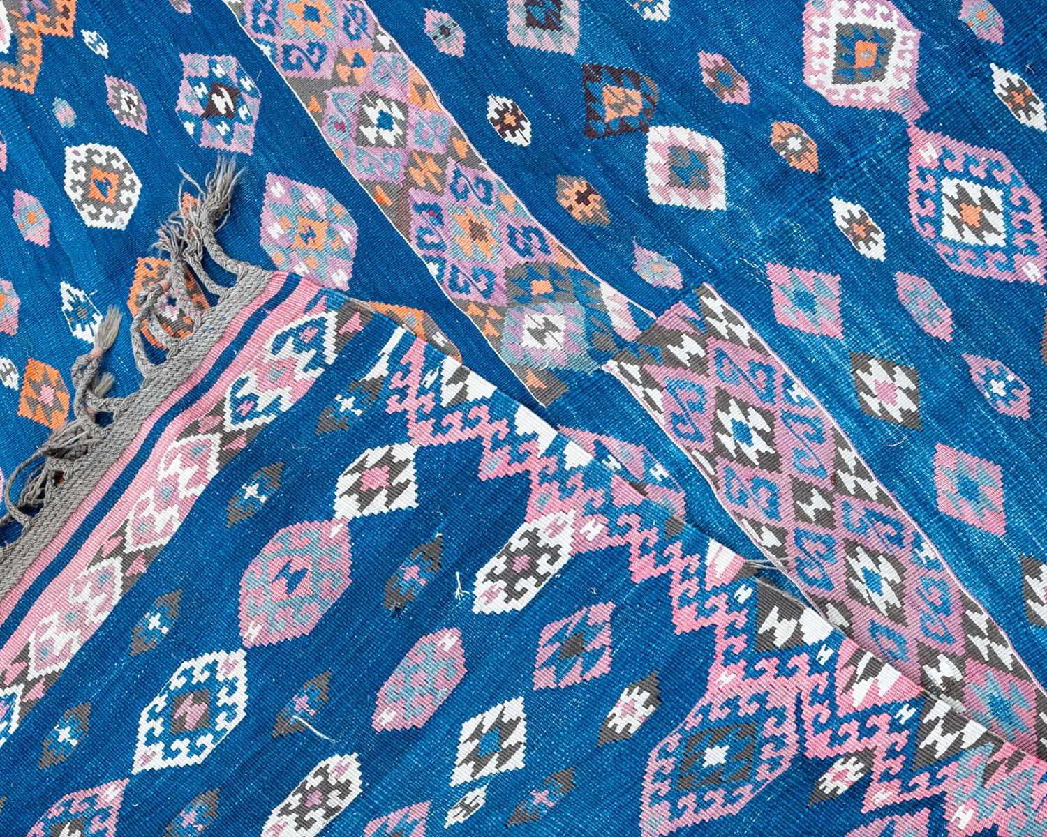 A blue ground Kelim with all over geometric decoration, 124cm x 200cmSome small holes, some - Image 2 of 2