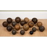 A group of various lawn bowls, mainly turned wood, the largest 11cm diameterIn used condition with