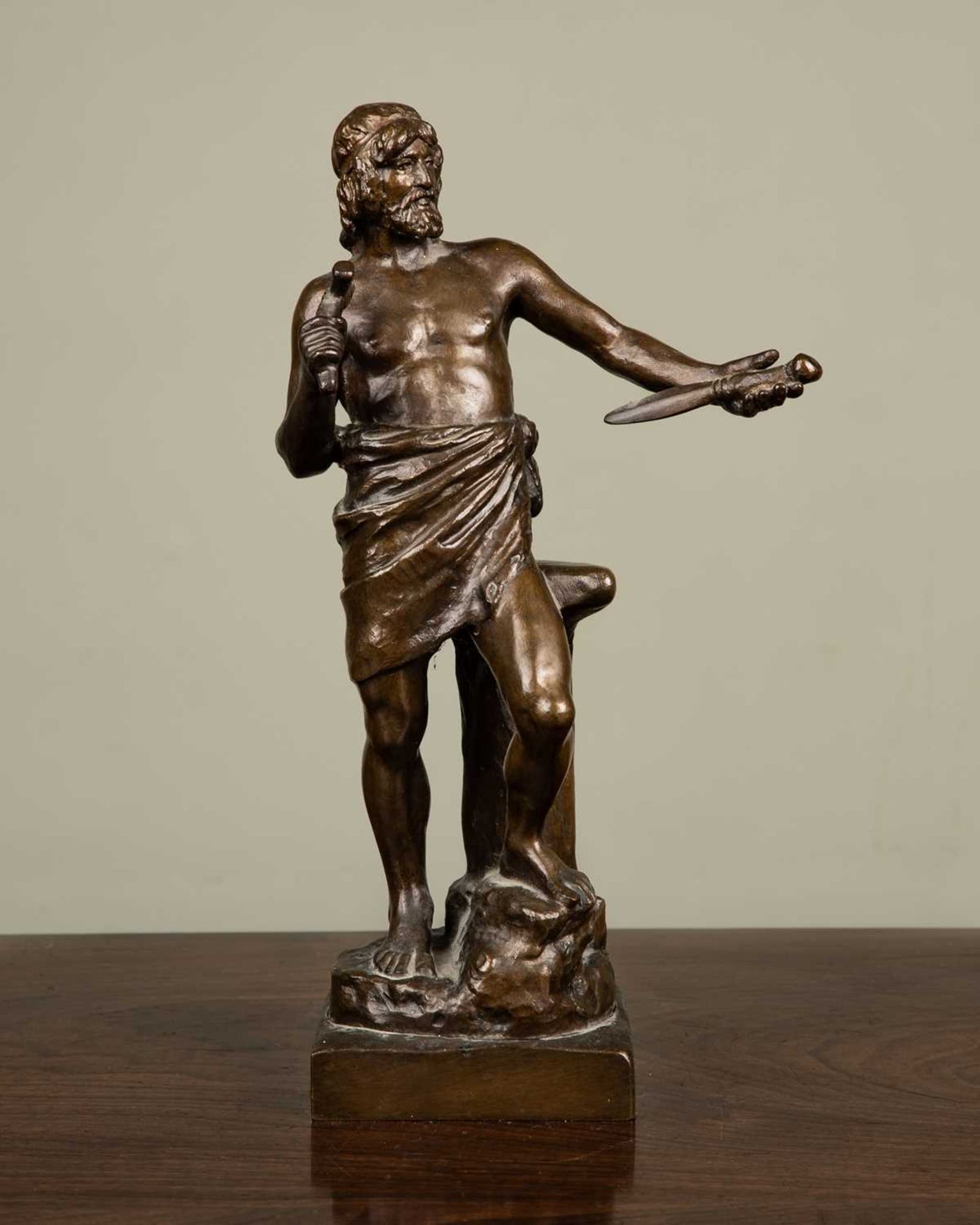 A bronze statue of Tubal Kain by Vilhelm Bissen, signed and dated '1868', holding blacksmith
