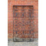 A black painted wrought iron panel with scroll ornaments, 168.5cm wide x 95cm highSome wear to the