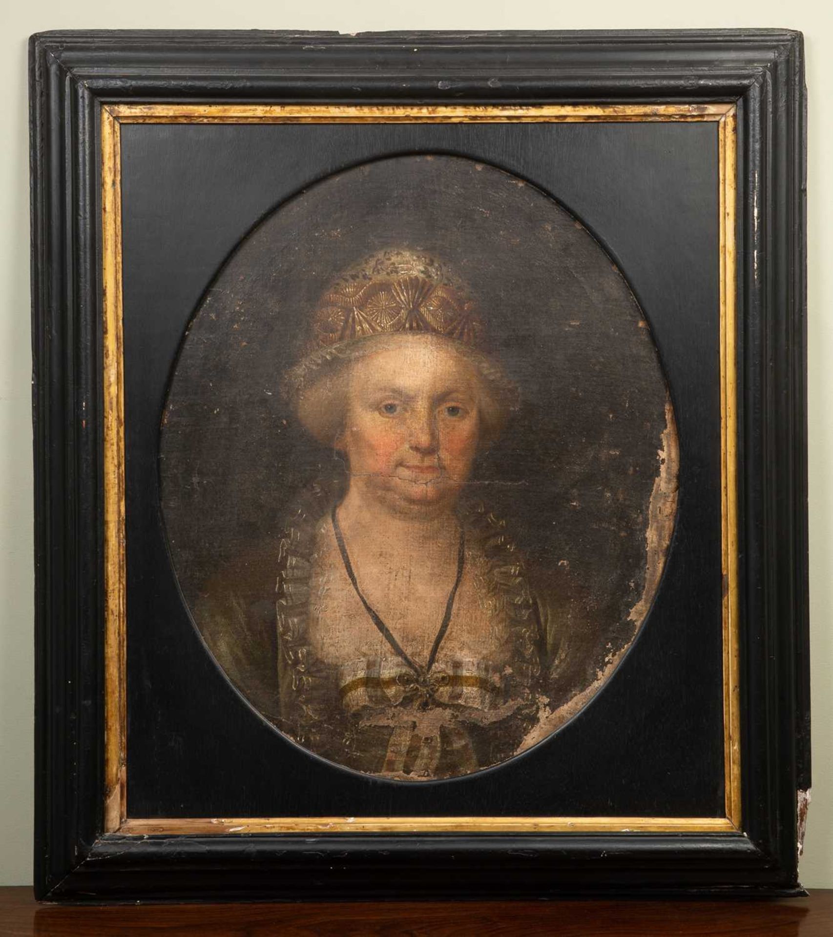 An 18th century portrait of a lady wearing a beaded bonnet, oil on canvas, unsigned, oval, 59.5cm - Image 2 of 6