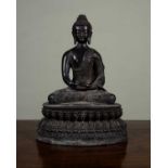 A 19th century bronze Buddha seated in the lotus position, on oval plinth base, 35cm highMinor marks