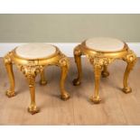 A pair of George III style giltwood marble inset urn stands on carved cabriole legs terminating in