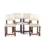 In the manner of Heals Set of four limed oak chairs, with cream upholstery and studded detail,