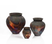 Pat Armstrong (Contemporary) Three Raku fired studio pottery vases, with copper fumed surface,