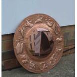 Arts and Crafts style copper framed 'zodiac' mirror, unmarked, 50cm acrossSome creases and small