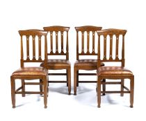 Arts and Crafts Set of four oak dining chairs, with drop-in seats and pierced splats, unmarked,