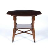 Aesthetic movement Rosewood table, octagonal topped, on 'x' stretchers, terminating in porcelain