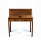 Cotswold School Walnut desk, with a pull-down top revealing compartments and drawers, above two