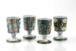 Aldermaston Pottery four studio pottery sherry cups, with handpainted decoration, signed to the