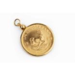 A South Africa 1/4 oz. Kruggerand, dated 1980, loose mounted in a yellow precious metal pendant