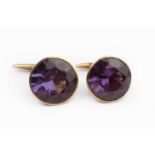 A pair of gem set cufflinks, the circular mixed-cut synthetic colour change sapphires in collet