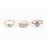 A pink sapphire and diamond cluster ring, the oval mixed-cut pink sapphire claw set within a