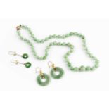 A collection of jade jewellery, comprising a graduated single strand bead necklace, the jade beads