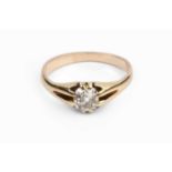 A diamond single stone ring, the cushion-shaped old-cut diamond in gypsy style setting, yellow