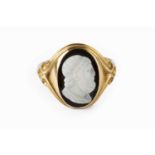 A mid-Victorian hardstone cameo ring, the oval cameo carved to depict a classical male portrait