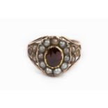 A 19th century gem set cluster ring, the possibly later oval mixed-cut garnet in foiled closed-