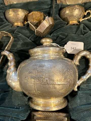 An extensive Vietnamese silver tea service, relief decorated and engraved with landscape - Image 7 of 10