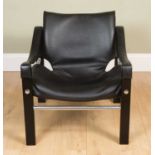 A black leather upholstered chair on chrome and ebonised wooden frame, 62.5cm wide, 60cm deep,