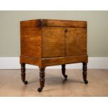 A 19th century mahogany cellarette, on turned supports and castors, 54cm wide x 37cm deep x 63cm