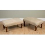 A pair of modern upholstered footstools on turned legs, 80cm wide x 50cm deep x 40cm high (2)