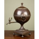 A Georgian copper and brass tea urn of globe form with ring handles, 28cm wide x 46cm highAt