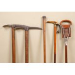 A World War II ice axe marked "Brades 1943", 82cm long, a further ice axe, a shooting stick, a