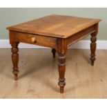 A Victorian pine kitchen table with a single drawer and turned tapering legs, 120cm wide x 86cm deep