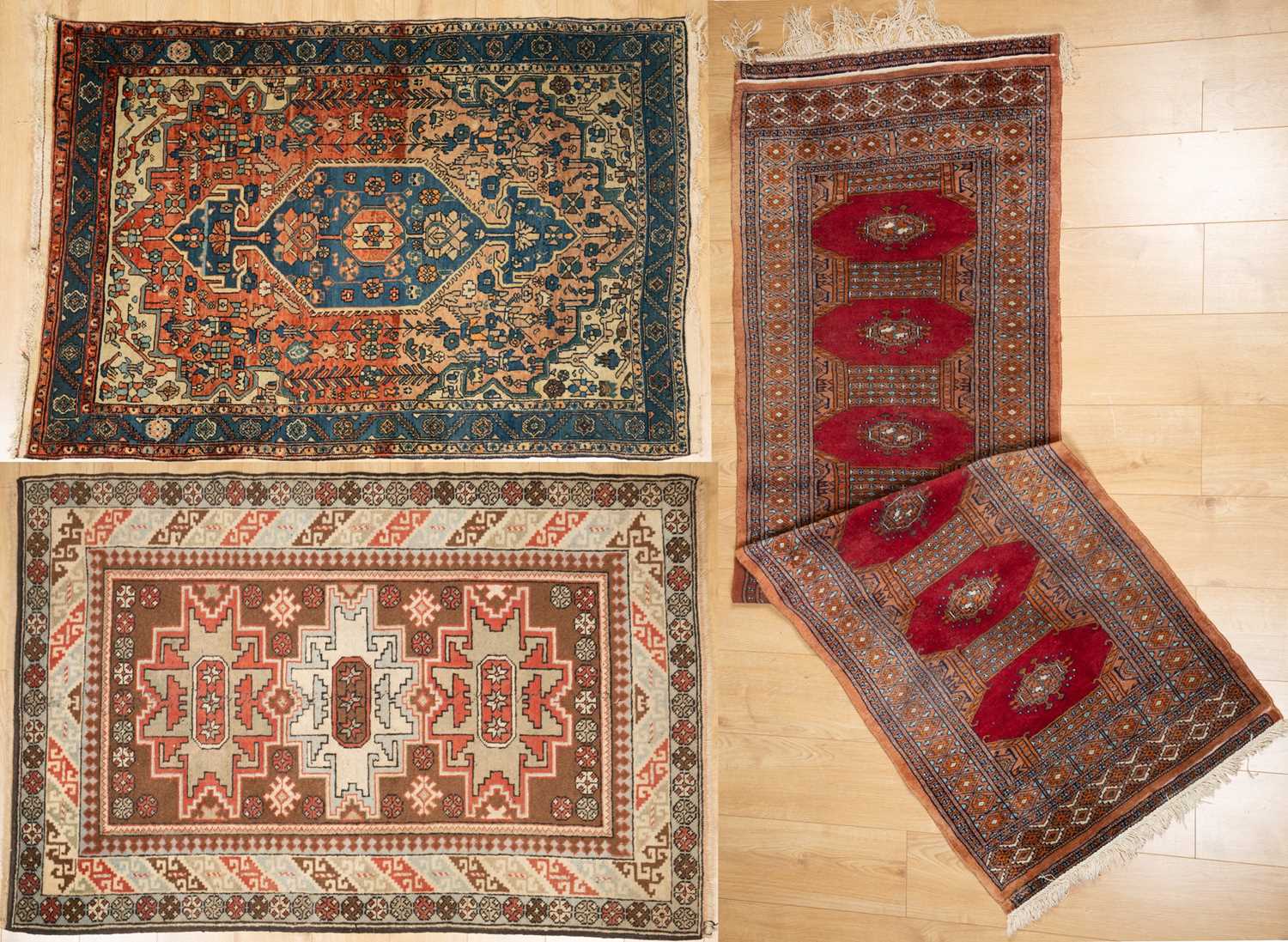 Three middle eastern rugs to include a red ground runner and a 20th century turkish rug. the largest