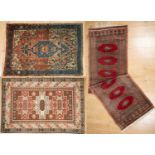 Three middle eastern rugs to include a red ground runner and a 20th century turkish rug. the largest