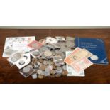 A collection of British and foreign coins and banknotes, to include seven silver threepences,