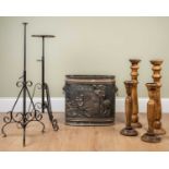 A pair of wrought iron candle stands on scrolling bases, 85cm high, together with; two pairs of