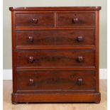 A Victorian mahogany chest of two short over three long graduated drawers, with turned handles on