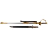 A gilt metal dress sword, with engraved scrolling decoration on the blade and scabbard, 97cm long,