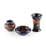 Moorcroft Three pomegranate pattern pieces a beaker vase, a squat vase, and a dish impressed marks