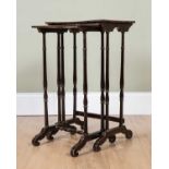 A nest of two scumble painted occasional tables with lined decoration, on delicately turned legs,