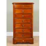 A tall mahogany chest of seven drawers on plinth base with ring pull handles, 42cm wide x 66cm