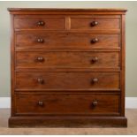 A large Victorian mahogany chest of two short and four long drawers with turned knob handles and a