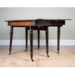 A mahogany extending dining table on carved column support and castors, 118cm wide, 94cm deep,