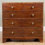 A Victorian mahogany chest of two short and three long drawers with brass turned handles, on bracket