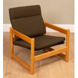 A Scandinavian style beechwood framed low open armchair 65c m wide x 59cm deep x seat height