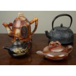 A group of four Asian teapots comprising two hardstone and two metal together with; a modern